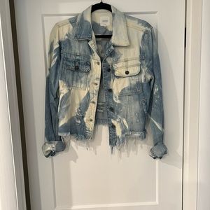 Denim jacket by Hidden. Distressed   Fringed in areas.
